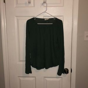 Green long sleeve with “v” cut out and bell sleeve
